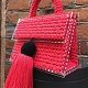 На второй фотографии маленькая красная сумка женская от Shapar, бренда вязаных вещей и аксессуаров ручной работы в интернет-магазине связанной спицами одежды.