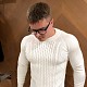 На пятой фотографии белый свитер с косами для мужчин от Shapar, бренда вязаной одежды ручной работы в интернет-магазине связанных спицами вещей.