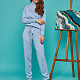На шестой фотографии брючный спортивный костюм голубой от Shapar, бренда вязаной одежды ручной работы в интернет-магазине связанных спицами вещей.