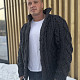 На фотографии теплый кардиган для мужчин от Shapar, бренда вязаной одежды ручной работы в интернет-магазине связанных спицами вещей.